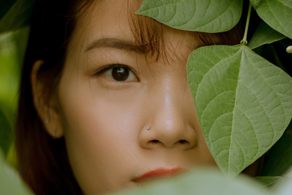 Girls Face on Green leaves with diamond nose stud