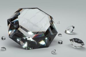Few different size black diamonds on white background
