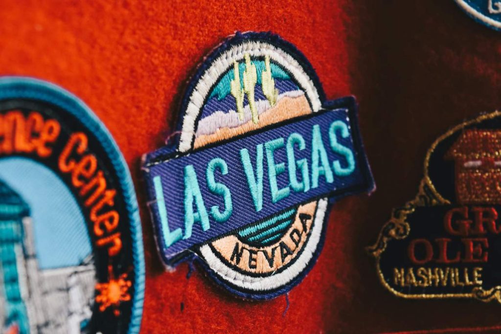 A patch with a Last Vegas name on it on red background