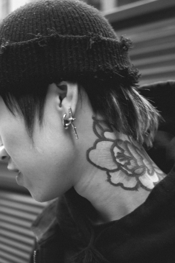 Flower neck tattoo on a woman