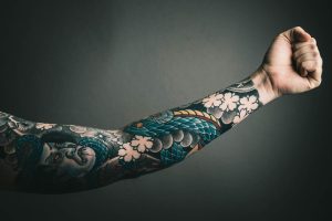 Sleeve tattoo on a mans hand