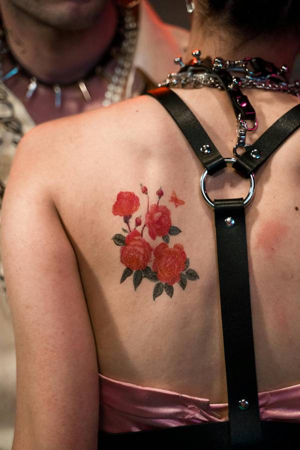 Woman with a flower back tattoo