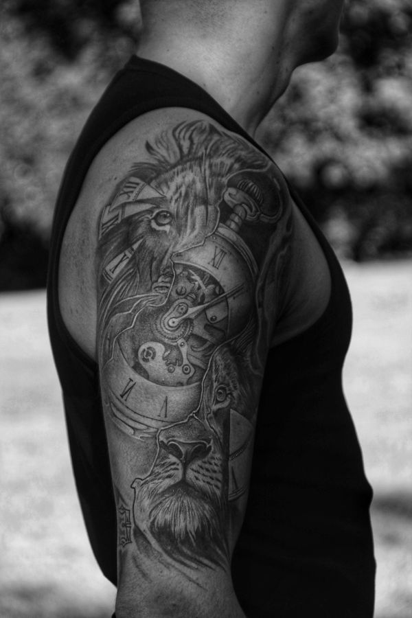 Man with a Lion tattoo on his arm