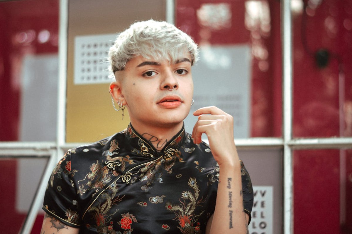 A gay man wearing piercings