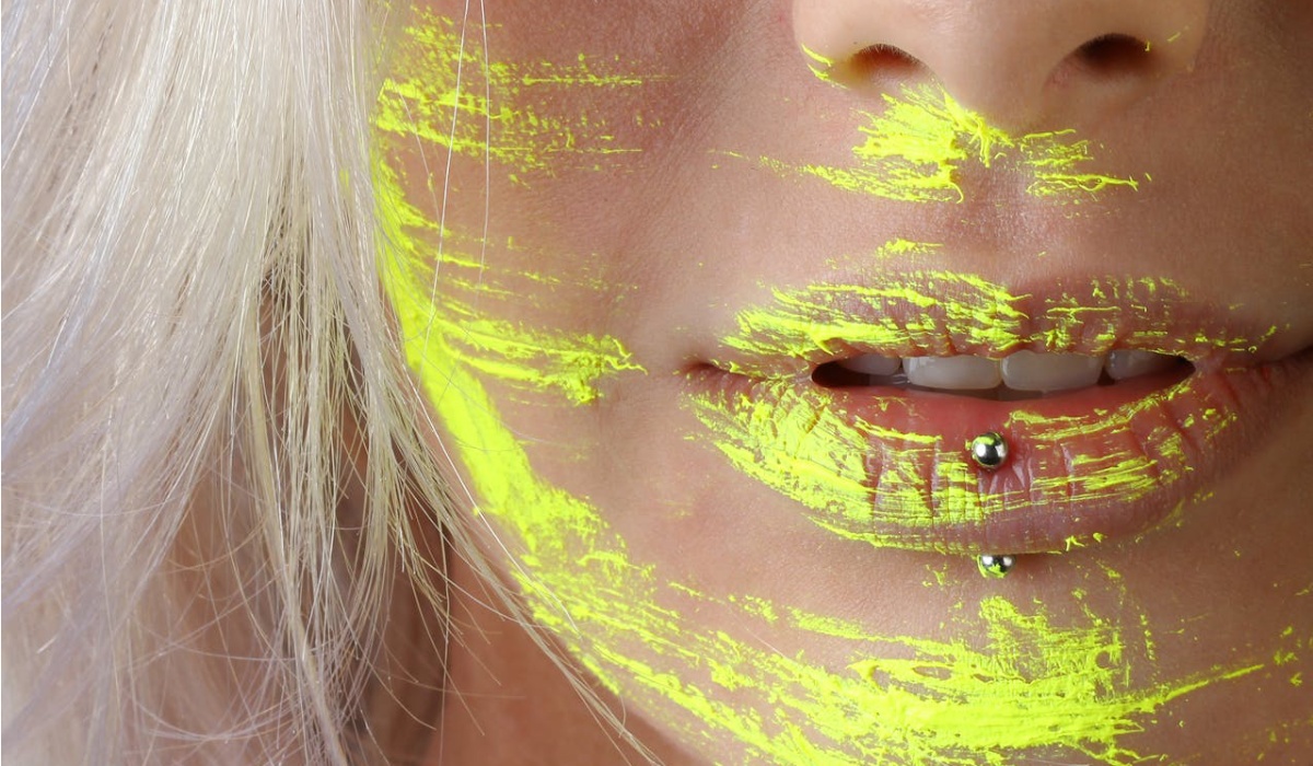 Mouth Piercing Woman with Yellow color on face